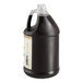 A jug of brown liquid with a white label.