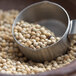 A bowl of Regal Whole White Peppercorns.