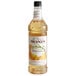 A Monin Premium Butterscotch Flavoring Syrup 1 Liter bottle with a label.