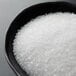 A bowl of Regal Coarse Sea Salt on a table.