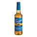 A Torani Sugar-Free Pumpkin Pie flavoring syrup bottle with a blue label.