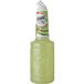 A bottle of Finest Call Premium Lite Margarita Mix with a white cap filled with green liquid with lime.