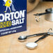 A box of Morton Iodized Table Salt next to a measuring spoon.