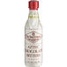A white plastic bottle of Fee Brothers Aztec Chocolate Bitters with a red cap and brown label.