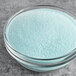 A bowl of Fanale blue mint powder mix on a table.