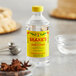 A close-up of a bottle of Shank's anise extract on a table.