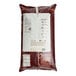 A close up of a bag of Callebaut milk chocolate callets with a label.
