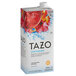 A white box of Tazo Sweetened Passion Iced Tea Concentrate with red and white design.