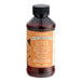 A brown LorAnn Oils bottle with a white label that reads "Cookie Butter Bakery Emulsion" on a counter.
