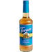 A Torani Sugar-Free Salted Caramel flavoring syrup 750 mL glass bottle with a blue label.
