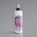 A white Satin Ice bottle of purple vanilla glitter glaze with a black cap.