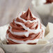 A chocolate cupcake with Satin Ice Pearl Vanilla Glitter Glaze on top.