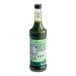 A green bottle of Monin Matcha Green Tea Concentrate.