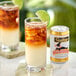 Two glasses of Goslings Ginger Beer with ice and lime on a table.