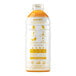 A white plastic bottle of Smartfruit Perfect Peach Puree with yellow and black text and orange liquid inside.