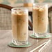Two glasses of Dr. Smoothie Cafe Essentials Vanilla Latte on a table.