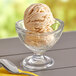 A bowl of Oringer caramel hard serve ice cream with a spoon.