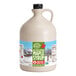 A Butternut Mountain Farm jug of maple syrup with a label.