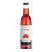 A close up of a bottle of Capora Raspberry flavoring syrup.