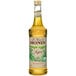 A close up of a Monin Organic Agave Nectar Sweetener Syrup bottle with a label.