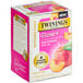 A white box of Twinings Glow Peach & Aloe Vera White Tea with a close-up of a peach.