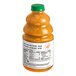 A bottle of Dr. Smoothie Orange Tangerine Smoothie Mix with orange liquid inside.