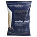 A blue Capora bag of white liquid with a label reading "Vanilla Latte Frappe Mix"
