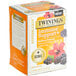 A box of Twinings Immune Support herbal tea bags with blackberries, hibiscus, and elderberries on a table.