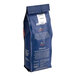 A blue bag of Lavazza Classico ground coffee with white text.