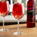 A wine glass filled with red DaVinci Gourmet raspberry syrup.