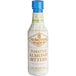 A bottle of Fee Brothers Toasted Almond Bitters with white and gold packaging.