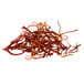 A pile of Shank's Spanish Saffron threads on a white background.