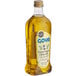A case of six Goya Extra Virgin Olive Oil bottles on a store counter.