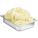 A metal container of Fabbri Delipaste Banana Flavoring with white swirls in it.