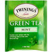 A green and white Twinings packet of green tea with mint tea bags.