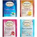 A group of 6 Twinings packages of assorted herbal tea bags with pink and blue packages.