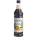 A bottle of Monin Old Fashioned Root Beer Syrup.