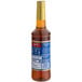 A Torani plastic bottle of brown sugar cinnamon syrup with a label.