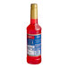 A red Torani bottle of liquid with a blue label.