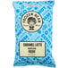 A blue bag of The Frozen Bean Caramel Latte coffee mix.