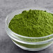 A bowl of Dona Kyoto Ceremonial Matcha Powder on a table.