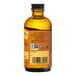A bottle of Nielsen-Massey Pure Almond Extract with a label.