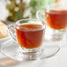 A glass cup of Lavazza Espresso Maestro Intenso.