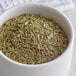 A bowl of Regal Herbs de Provence seasoning on a table.