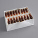 A white box with 72 brown rock candy swizzle sticks.