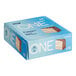 A blue ONE Birthday Cake Protein Bar box with white text and a square image of cake with sprinkles.