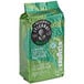 A green bag of Lavazza Tierra! Brasile Intense whole bean coffee on a white background.