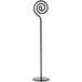 A black metal Cal-Mil card holder with a spiral design on the pole.