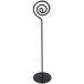 A black metal Cal-Mil table card holder with a spiral design.