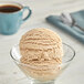 A bowl of Oringer graham cracker hard serve ice cream with a spoon.